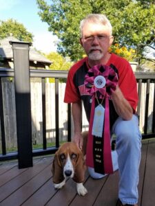 Dan Niles proudly shows off Angelique's BCAT title ribbon in September 2019. 